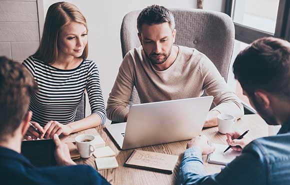 Group of people working together during a meeting