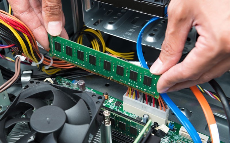Kingston RAM built for performance User installing RAM board into computer